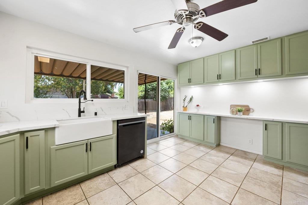 809 Buchanan Street Escondido, CA 92027 - Photo 15 of 32 a kitchen with a sink cabinets and window