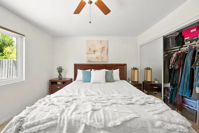 a large white bed in a white room