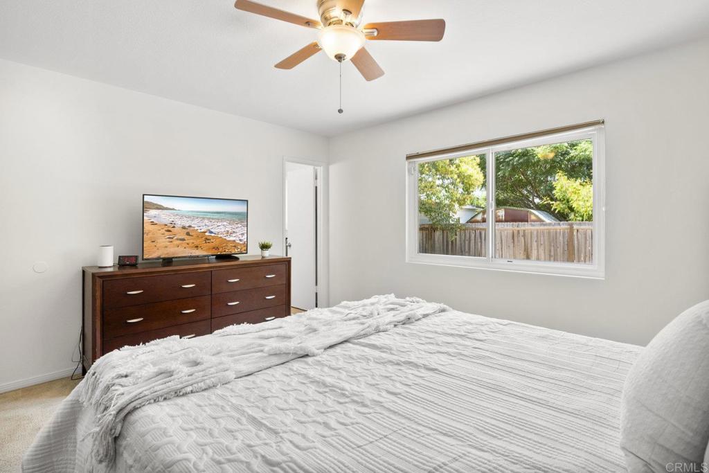 809 Buchanan Street Escondido, CA 92027 - Photo 19 of 32 a bedroom with a bed and a window