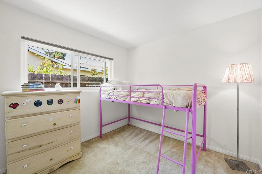 809 Buchanan Street Escondido, CA 92027 - Photo 21 of 32 a bedroom with a bed and a window