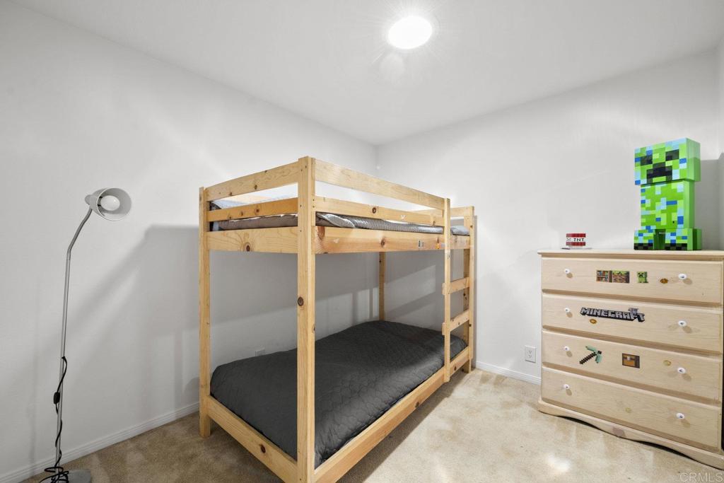 809 Buchanan Street Escondido, CA 92027 - Photo 22 of 32 a bedroom with a bunk bed and a dresser