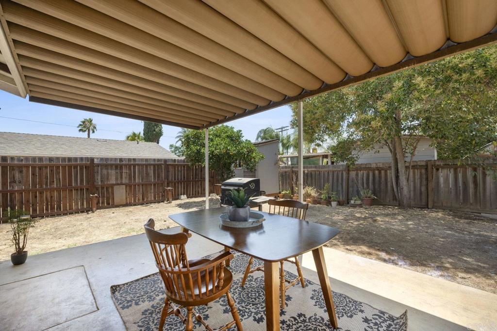 809 Buchanan Street Escondido, CA 92027 - Photo 24 of 32 a patio with glass top table and chairs