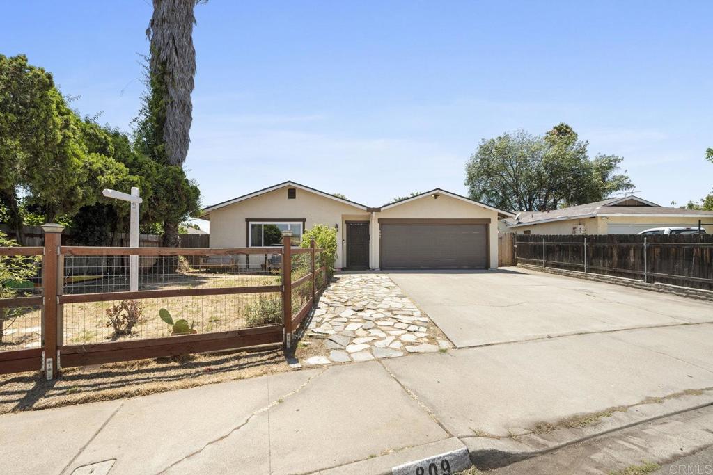 809 Buchanan Street Escondido, CA 92027 - Photo 28 of 32 a front view of a house with a yard