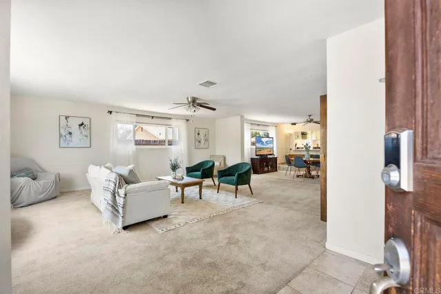 a living room with furniture and a table