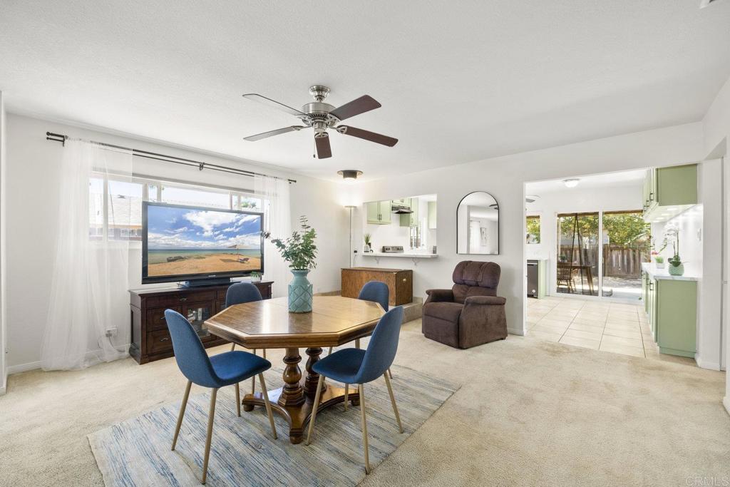 809 Buchanan Street Escondido, CA 92027 - Photo 7 of 32 a living room with furniture a large window and a chandelier