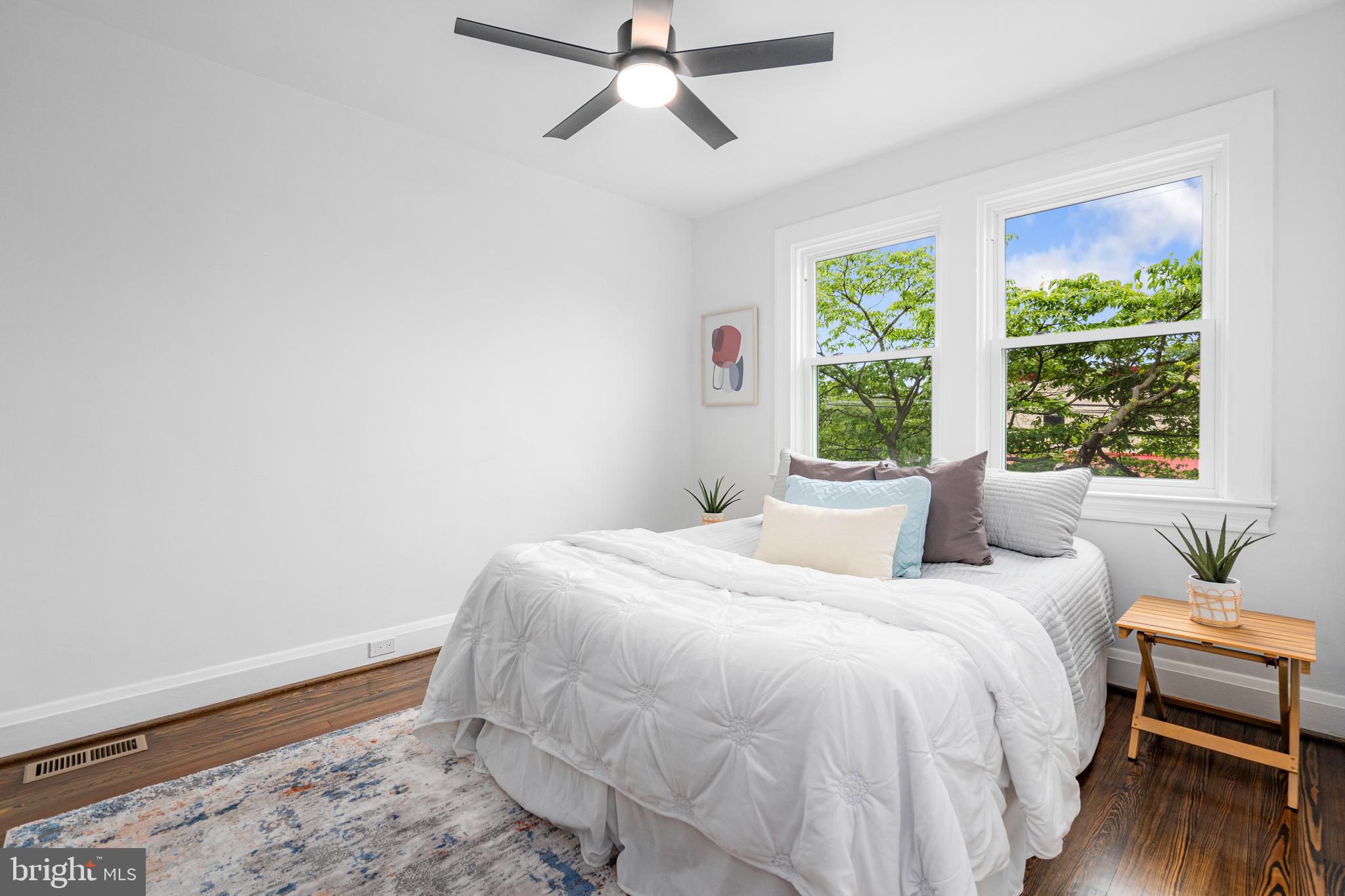 83 Willow Spring Road Dundalk, MD 21222 - Photo 21 of 36 a bedroom with a bed and wooden floor