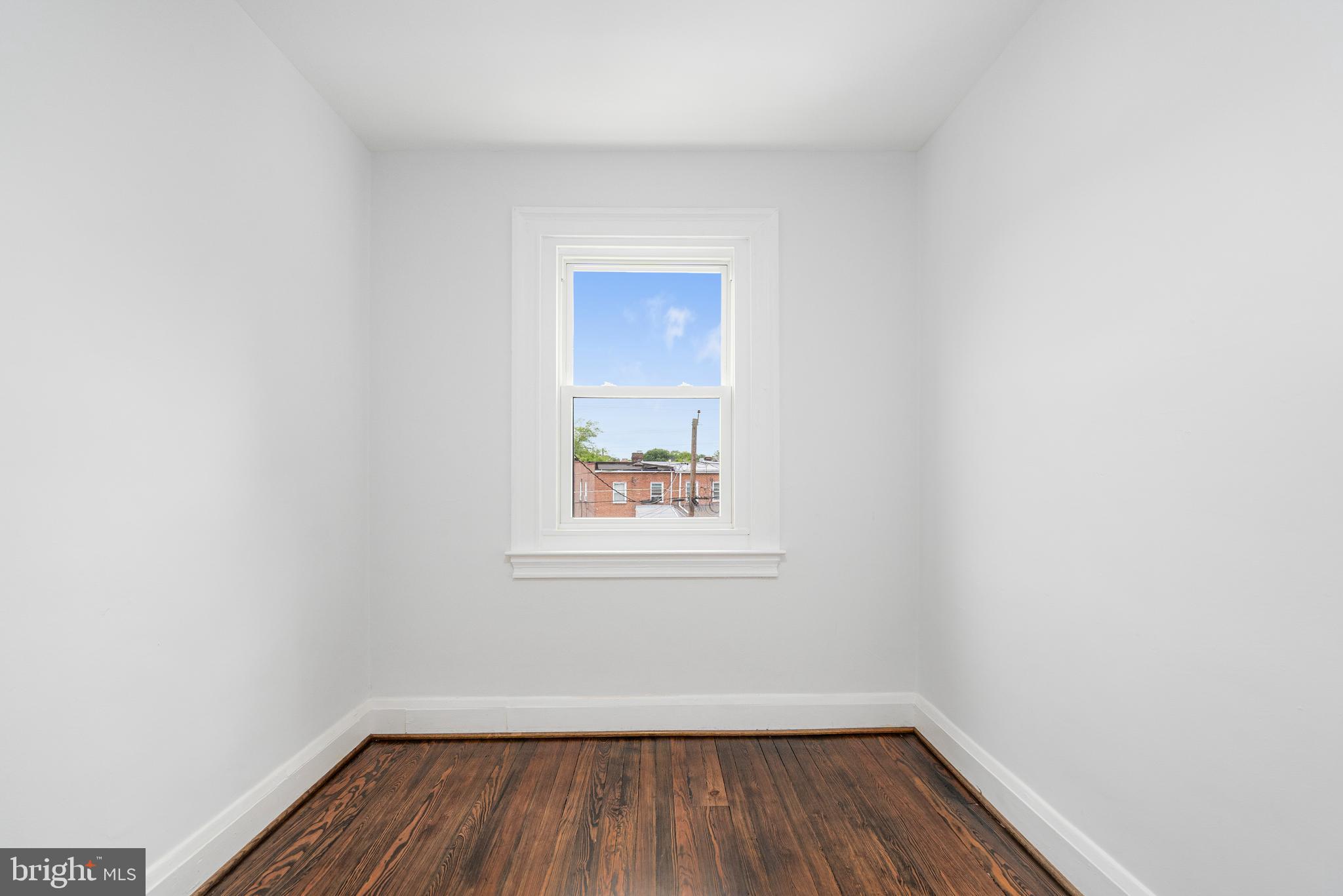 83 Willow Spring Road Dundalk, MD 21222 - Photo 27 of 36 a view of a small space with wooden floor and a window
