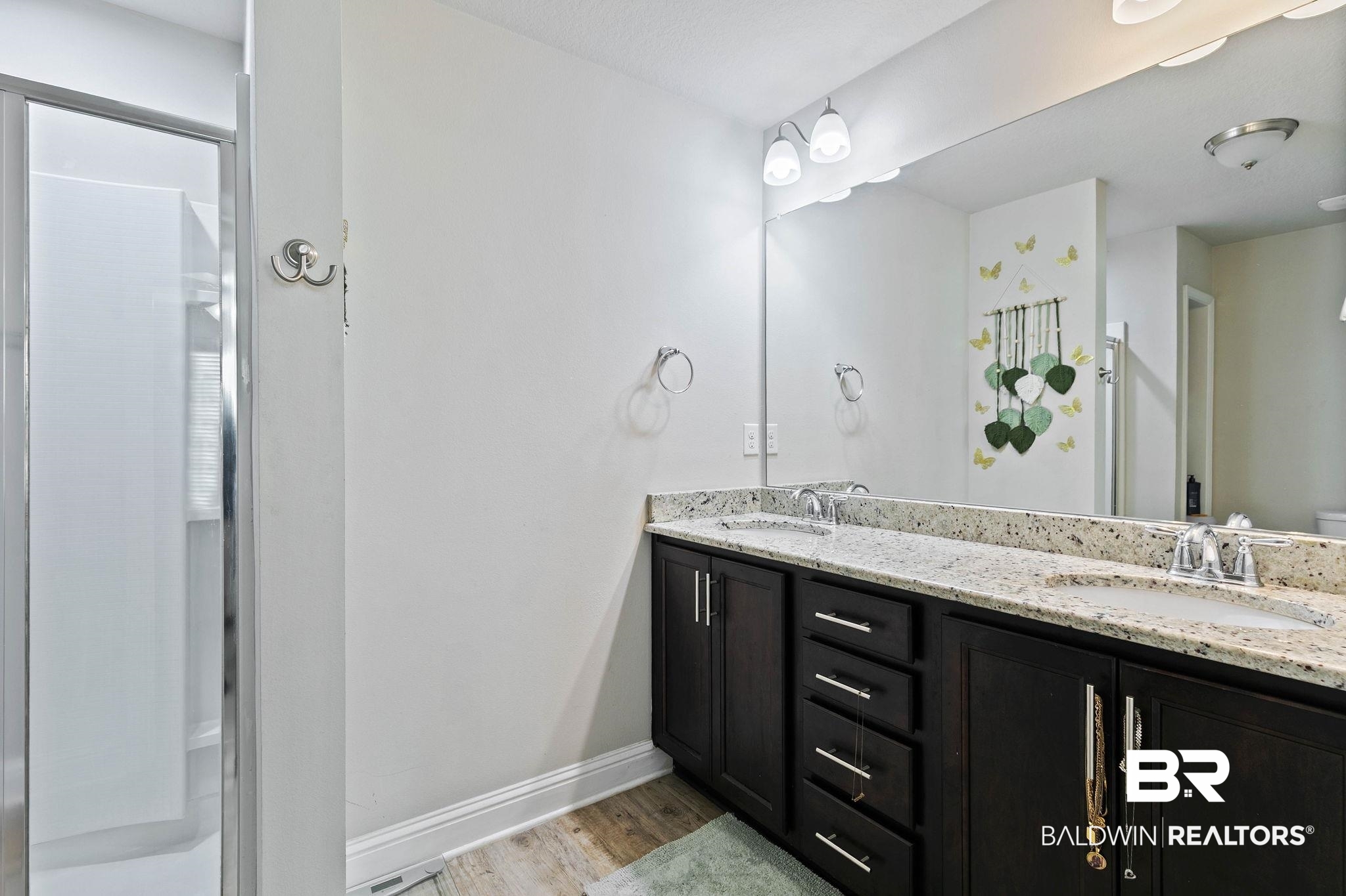 25806 Pollard Road, Unit 24 Daphne, AL 36526 - Photo 19 of 33 Full bath featuring light wood finished floors and double vanity