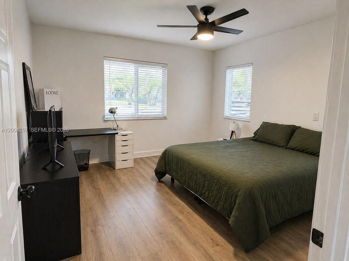 426 Southwest 26th Road Miami, FL 33129 - Photo 6 of 9 a bedroom with a bed and a window