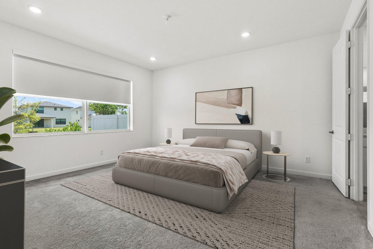 19659 Rugged Trunk Trail Loxahatchee, FL 33470 - Photo 14 of 61 a bedroom with a bed and a window