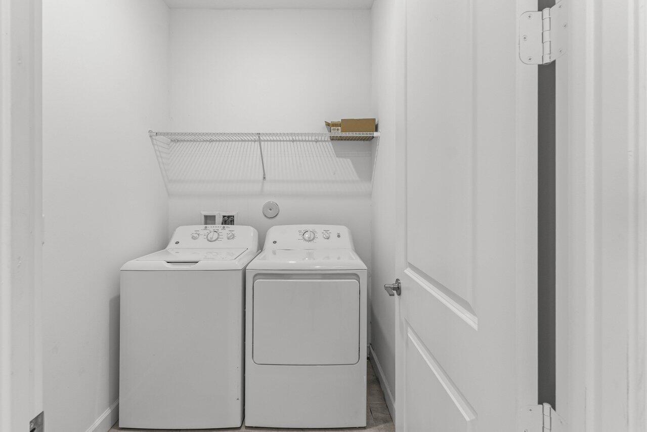 19659 Rugged Trunk Trail Loxahatchee, FL 33470 - Photo 22 of 61 a utility room with dryer and washer