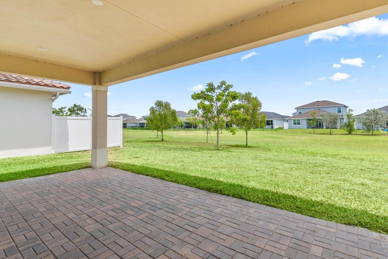 19659 Rugged Trunk Trail Loxahatchee, FL 33470 - Photo 31 of 61 a view of a house with a yard