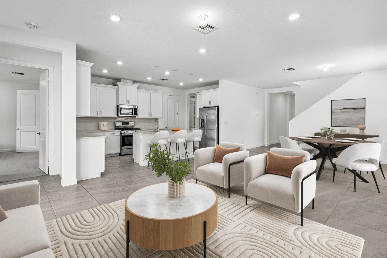 19659 Rugged Trunk Trail Loxahatchee, FL 33470 - Photo 4 of 61 a living room with furniture kitchen and a table