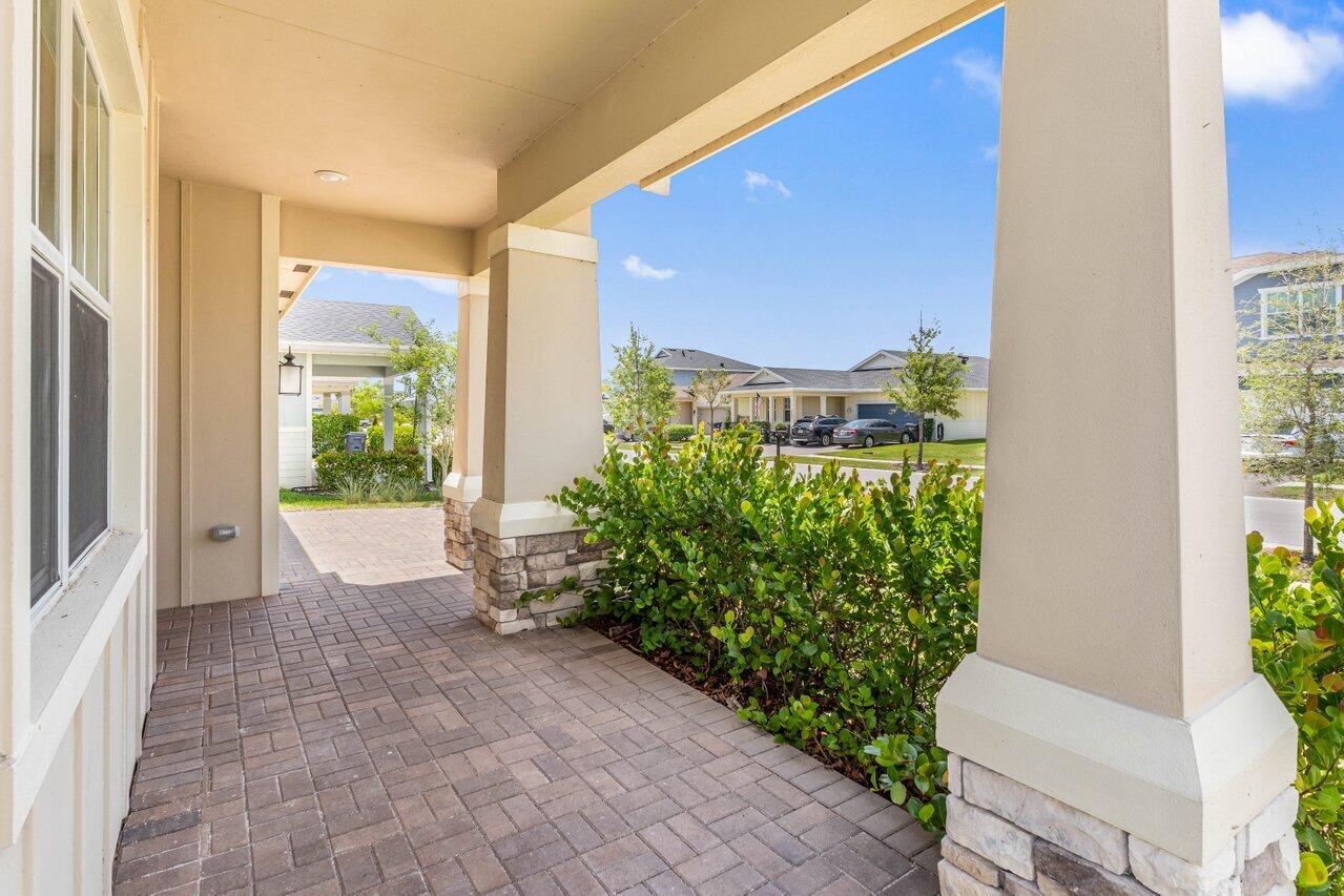19659 Rugged Trunk Trail Loxahatchee, FL 33470 - Photo 7 of 61 a view of a back yard from a corridor