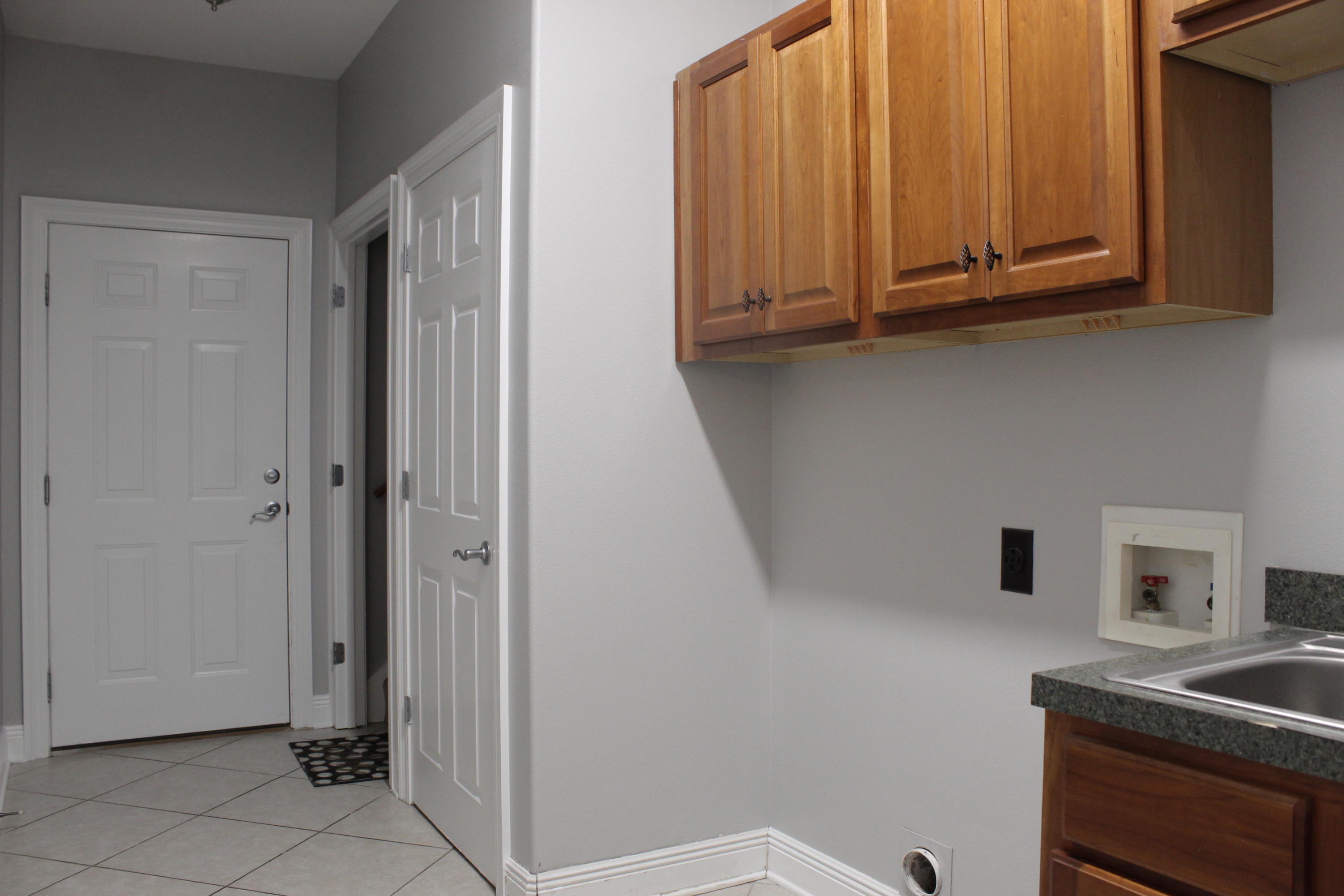 189 Red Maple Way Niceville, FL 32578 - Photo 25 of 58 a kitchen with stainless steel appliances granite countertop a refrigerator and microwave