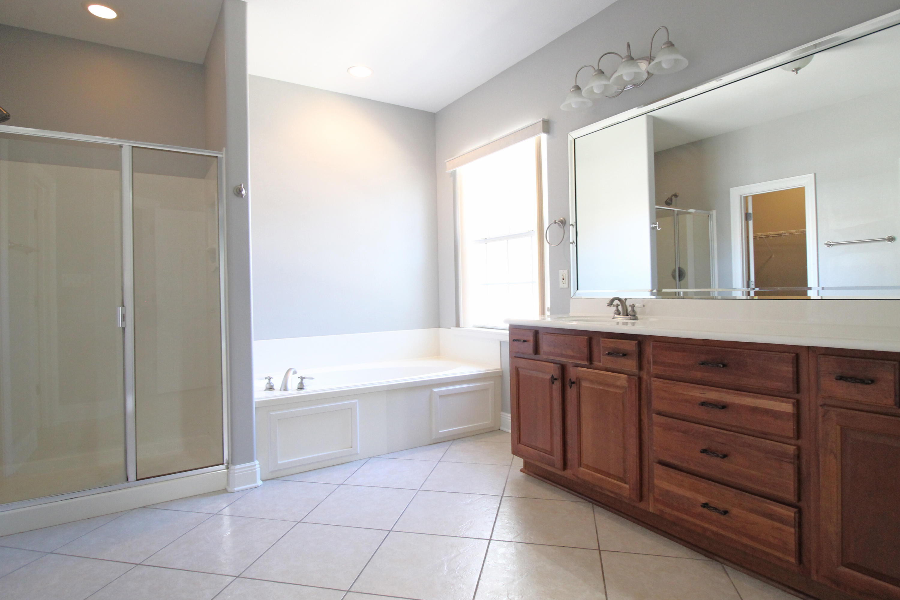 189 Red Maple Way Niceville, FL 32578 - Photo 28 of 58 a spacious bathroom with a tub sink and mirror