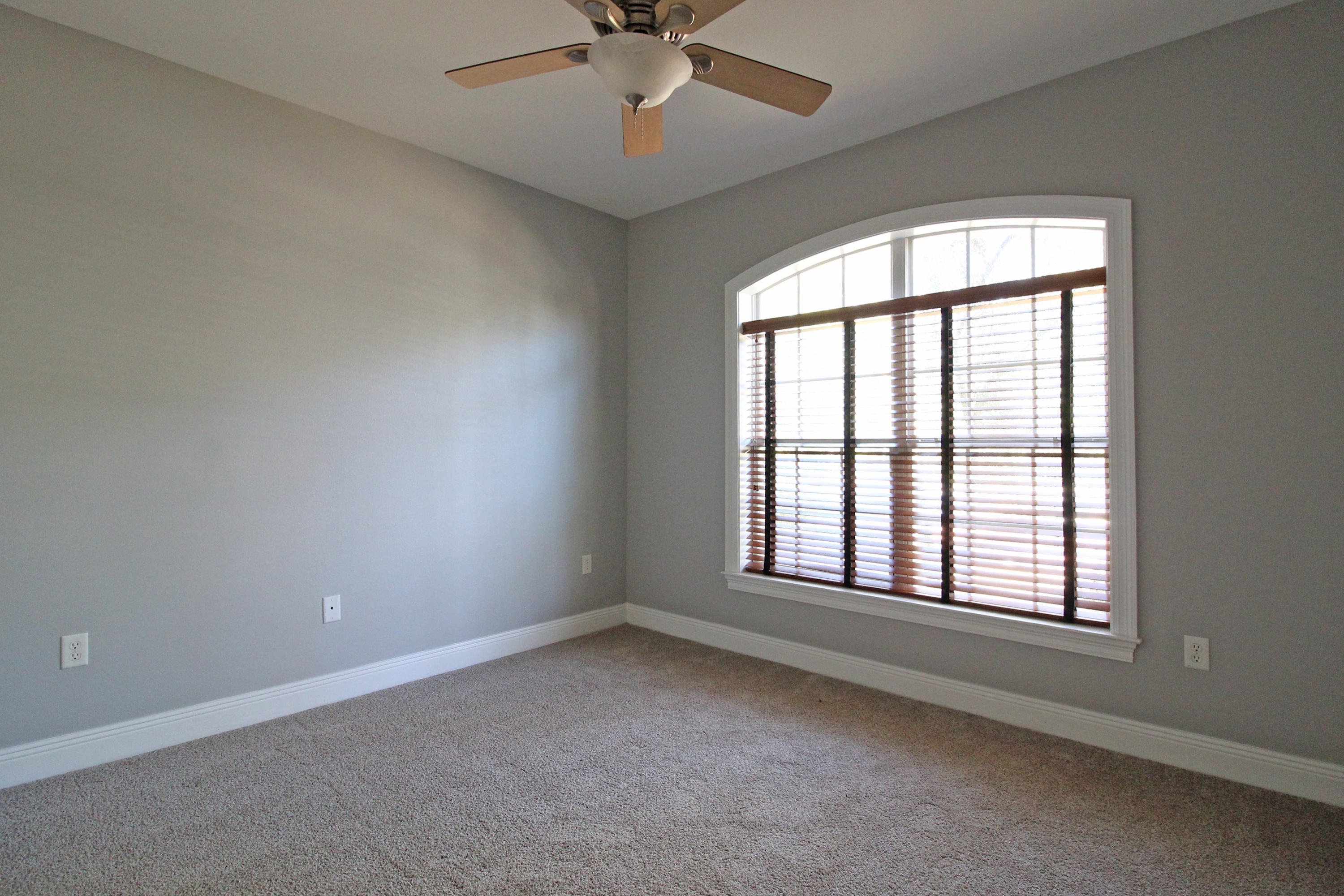 189 Red Maple Way Niceville, FL 32578 - Photo 30 of 58 an empty room with a window and a fan