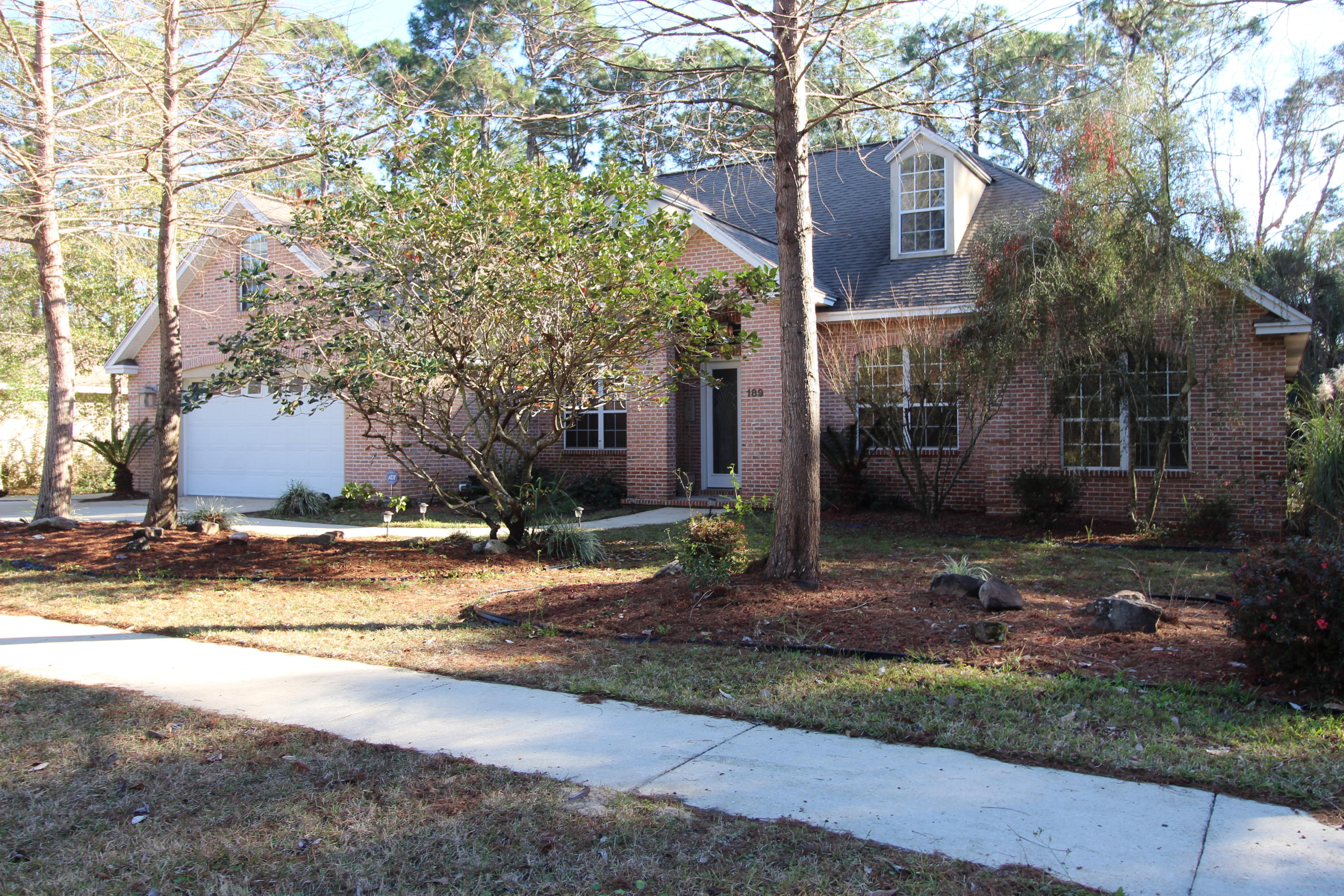 189 Red Maple Way Niceville, FL 32578 - Photo 3 of 58 a view of a house with a yard and large tree
