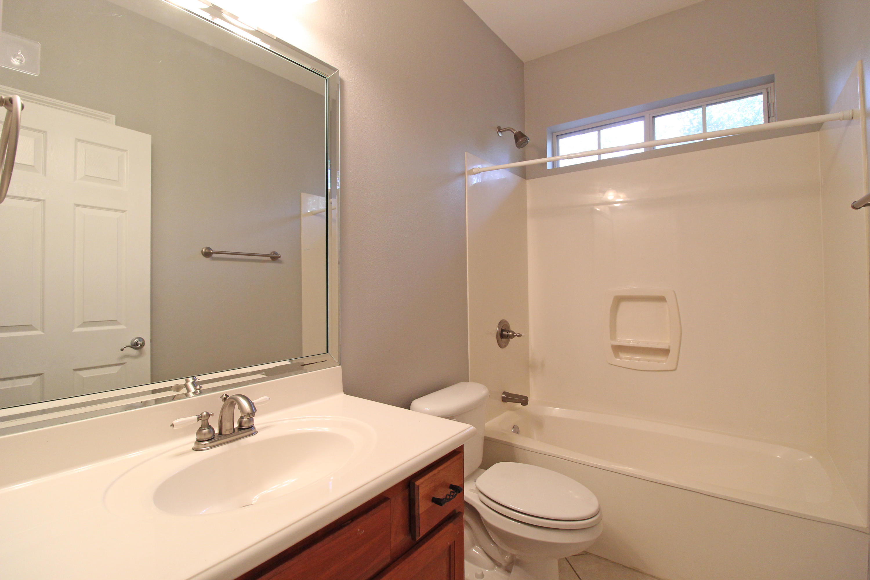 189 Red Maple Way Niceville, FL 32578 - Photo 31 of 58 a bathroom with a sink a toilet and shower a mirror
