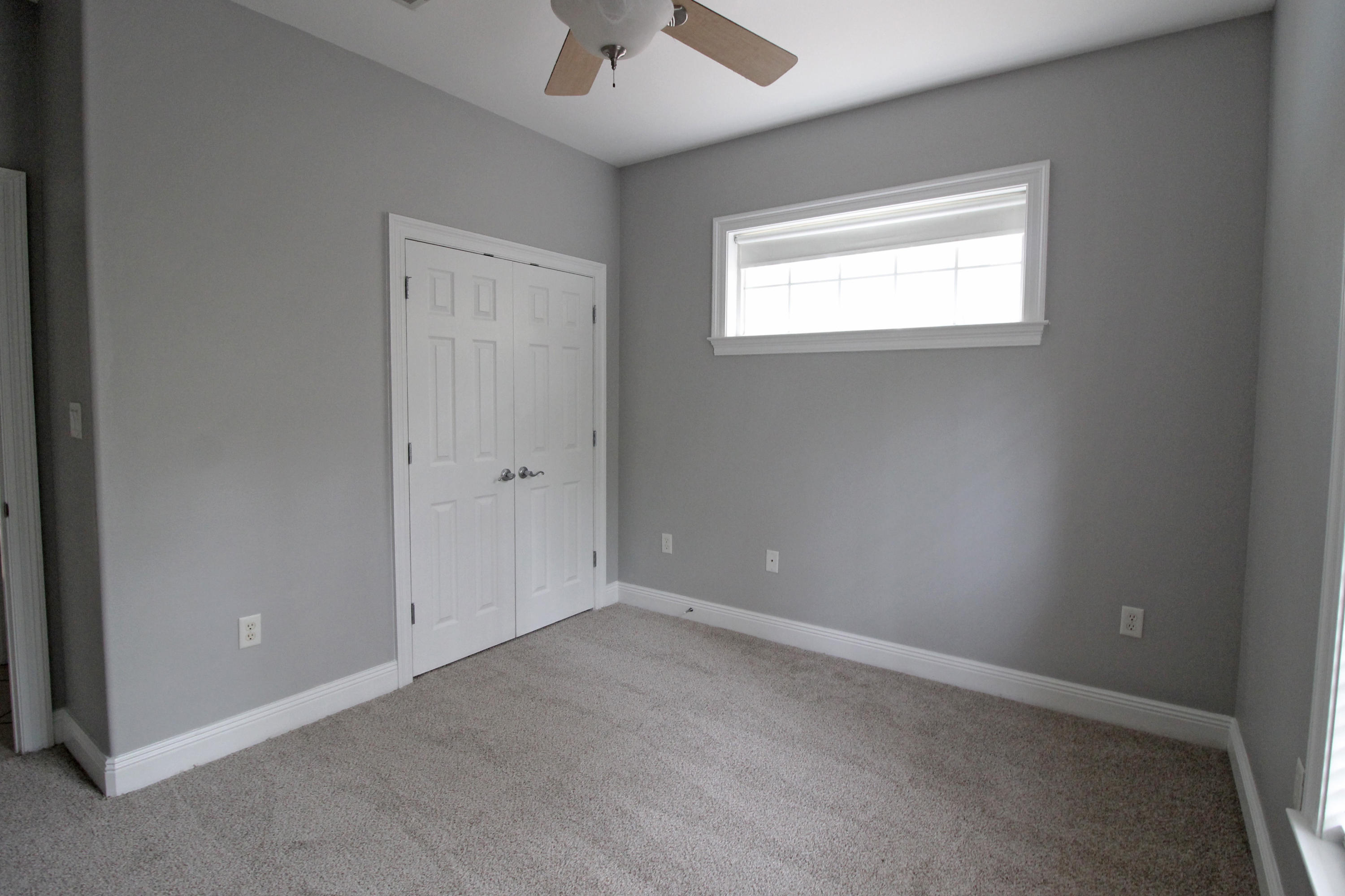 189 Red Maple Way Niceville, FL 32578 - Photo 33 of 58 an empty room with a window and a ceiling fan