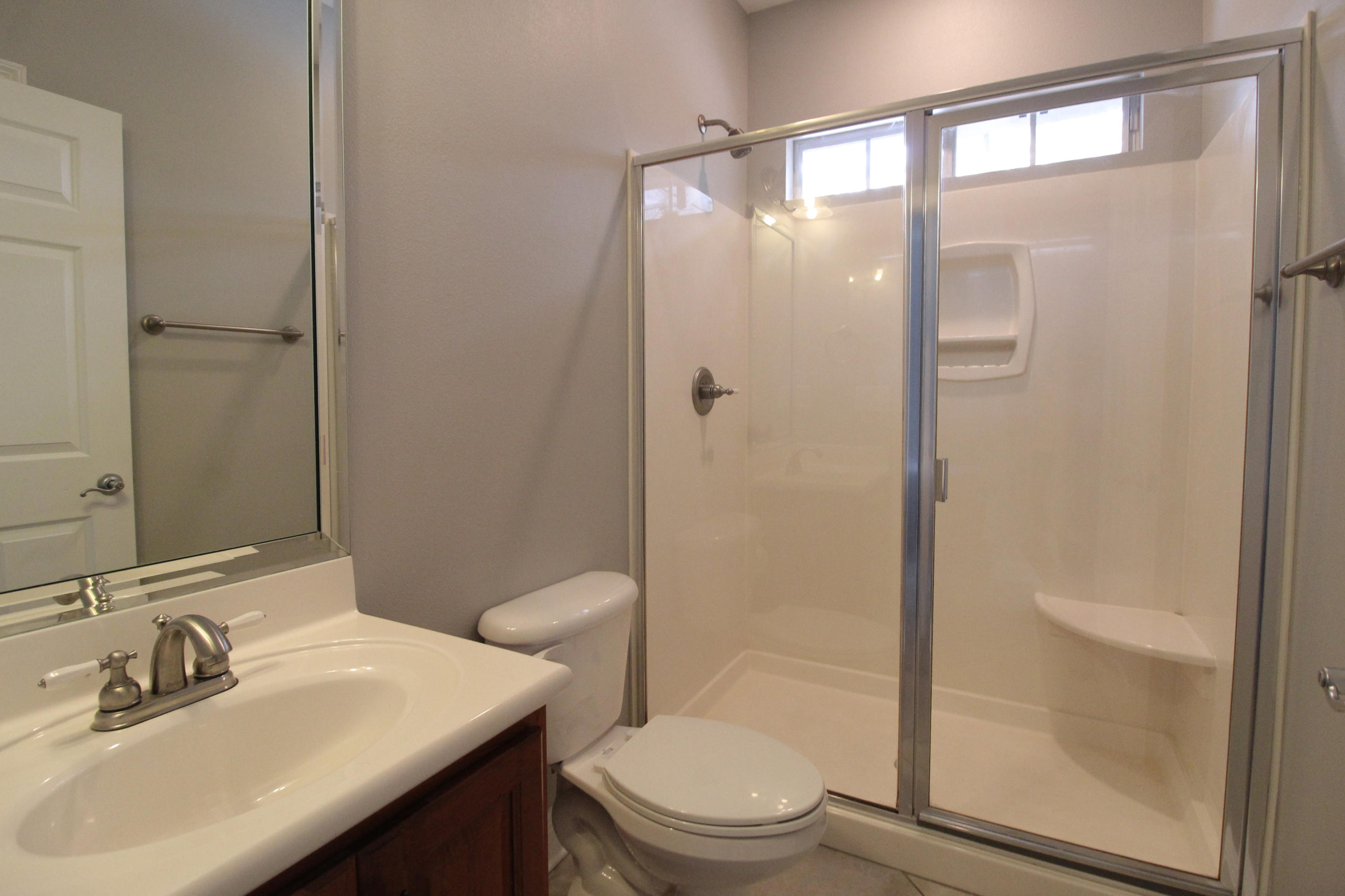 189 Red Maple Way Niceville, FL 32578 - Photo 34 of 58 a bathroom with a sink mirror shower and toilet