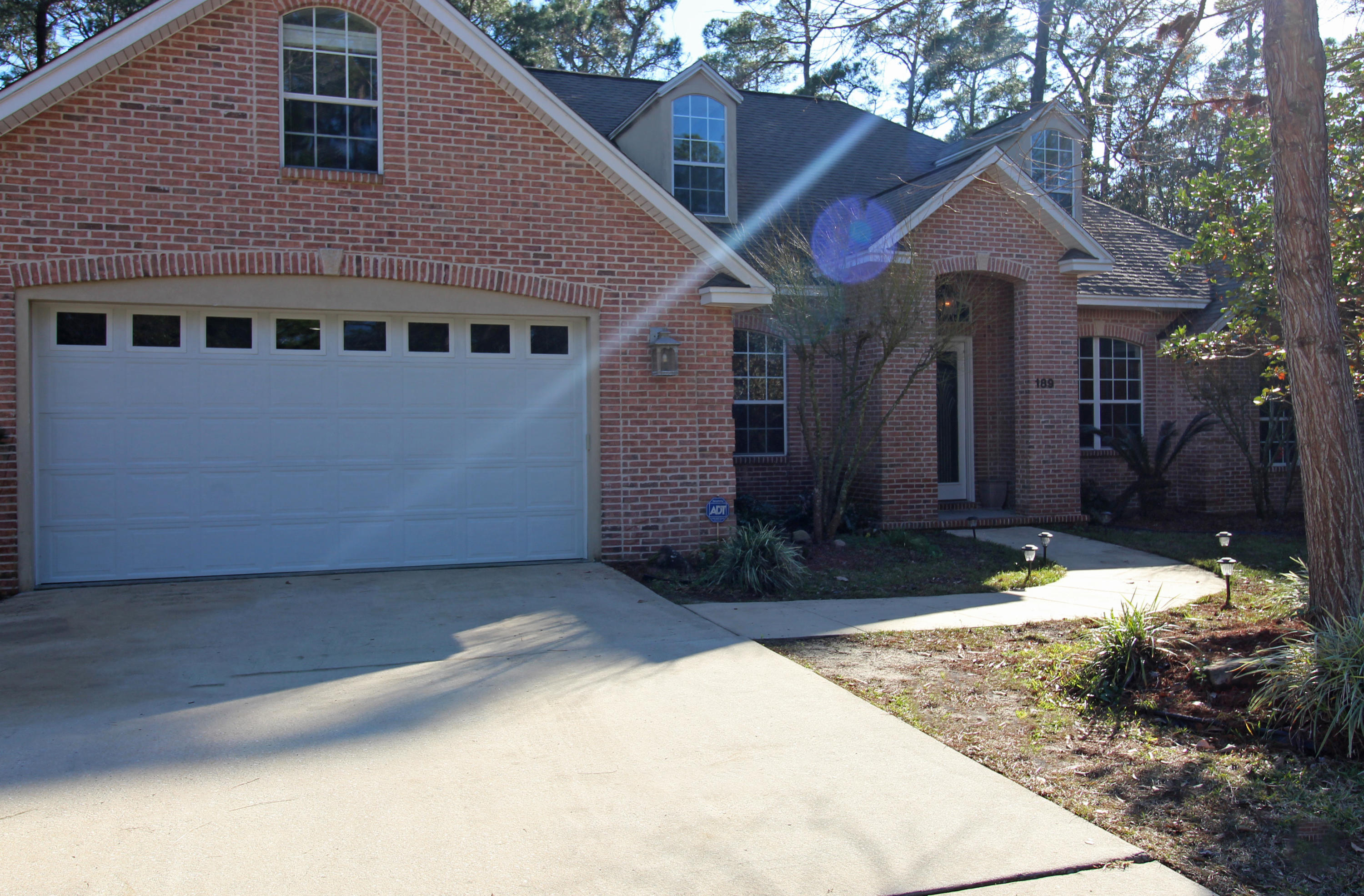 189 Red Maple Way Niceville, FL 32578 - Photo 4 of 58 a front view of a house with a yard and garage