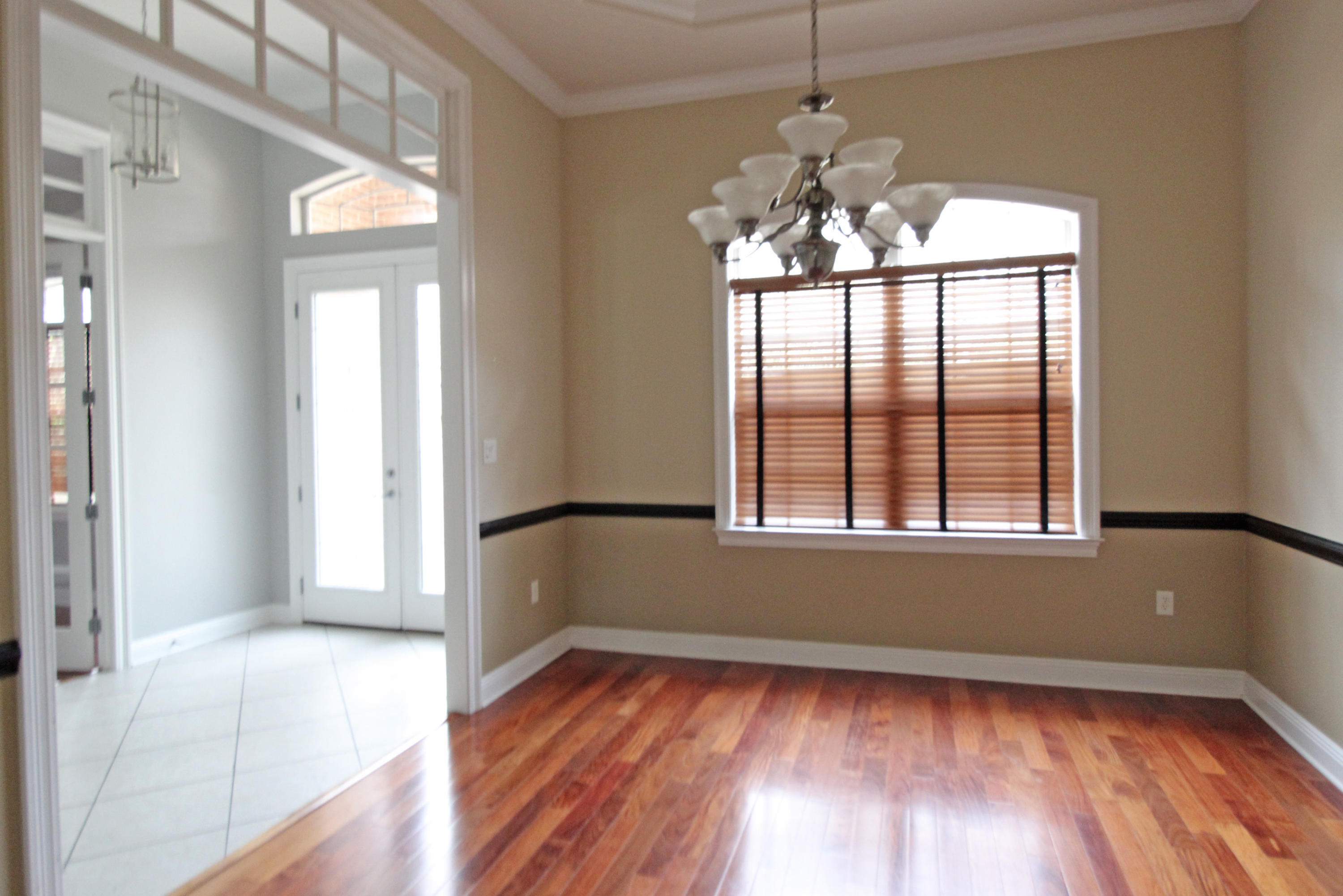189 Red Maple Way Niceville, FL 32578 - Photo 9 of 58 a view of empty room with wooden floor and fan