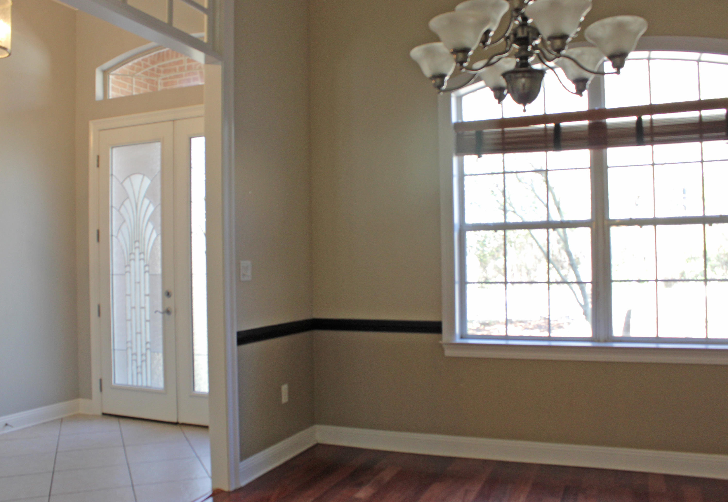 189 Red Maple Way Niceville, FL 32578 - Photo 10 of 58 a view of empty room with wooden floor and fan