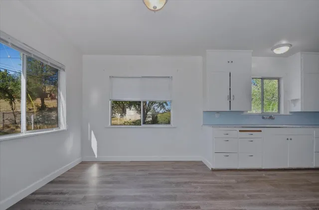 a view of an empty room and closet area