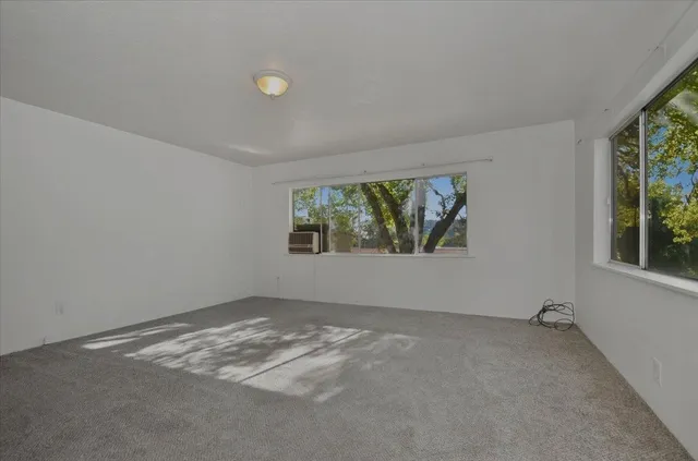a view of a kitchen cabinets and wooden floor