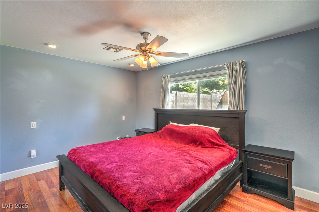 1201 I Boulder City, NV 89005 - Photo 14 of 26 Bedroom featuring wood finished floors and a ceiling fan