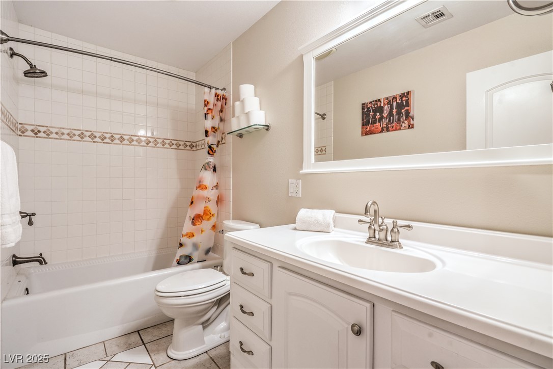 1201 I Boulder City, NV 89005 - Photo 17 of 26 Full bath with vanity, shower / tub combo, and tile patterned floors