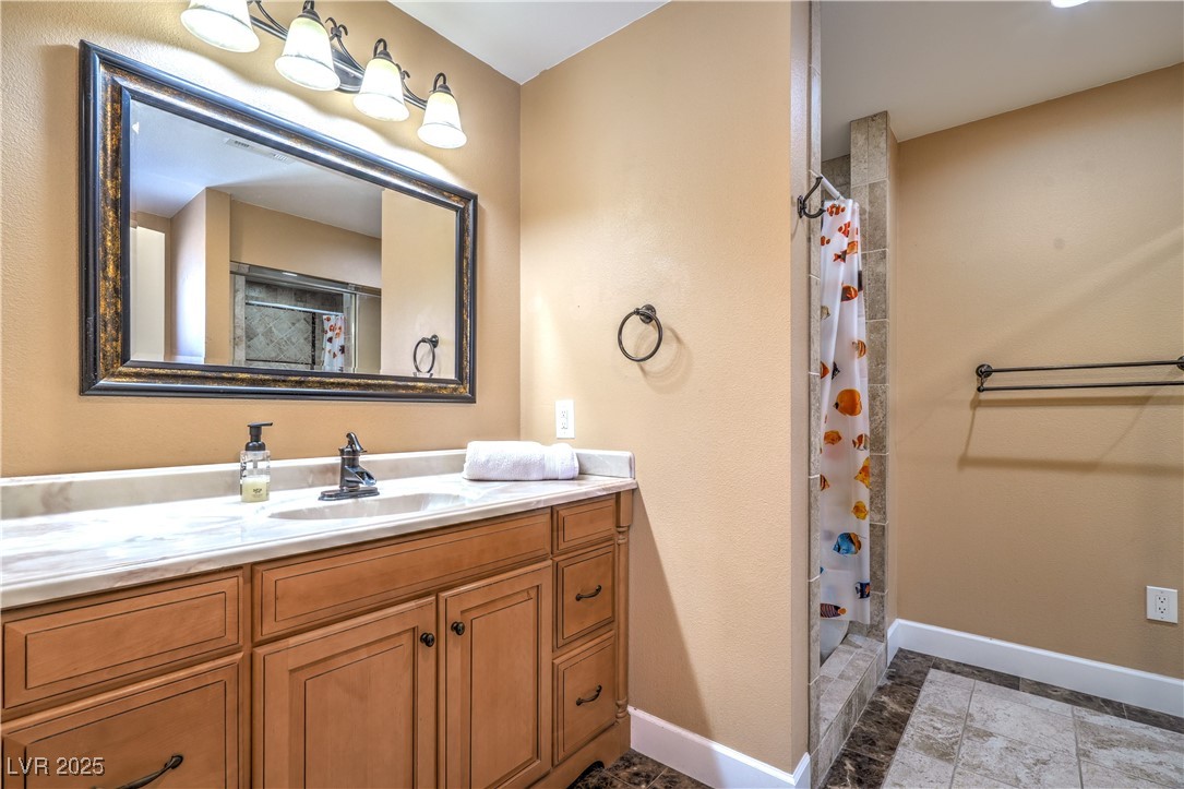 1201 I Boulder City, NV 89005 - Photo 20 of 26 Full bath featuring vanity and a shower with shower curtain