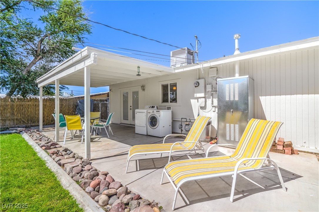 1201 I Boulder City, NV 89005 - Photo 22 of 26 View of patio / terrace featuring washing machine and dryer and french doors