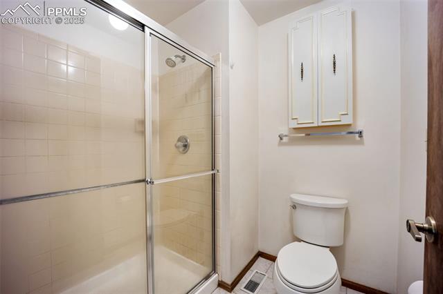 103 Saddlemountain Road Colorado Springs, CO 80919 - Photo 15 of 30 Bathroom with toilet and a shower stall