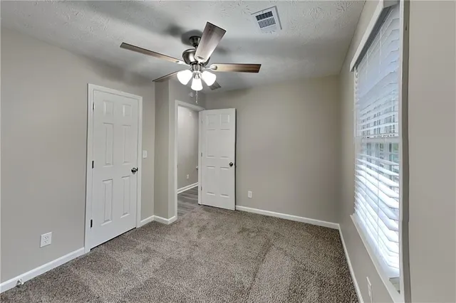 a view of an empty room and window