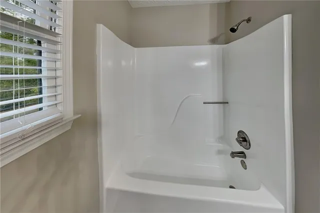 a close up of a bathtub in a bathroom