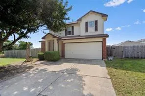 a view of backyard of house and wooden deck