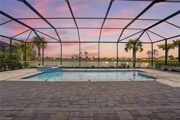 a view of a swimming pool with a lounge chair