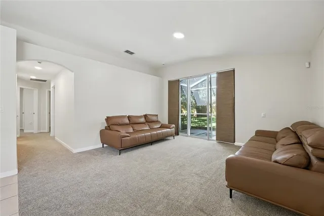 a view of a hallway with wooden floor and closet