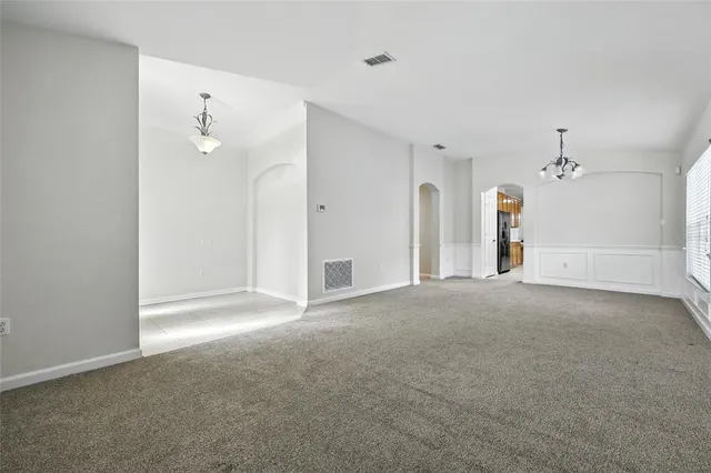 a kitchen with refrigerator a sink and cabinets