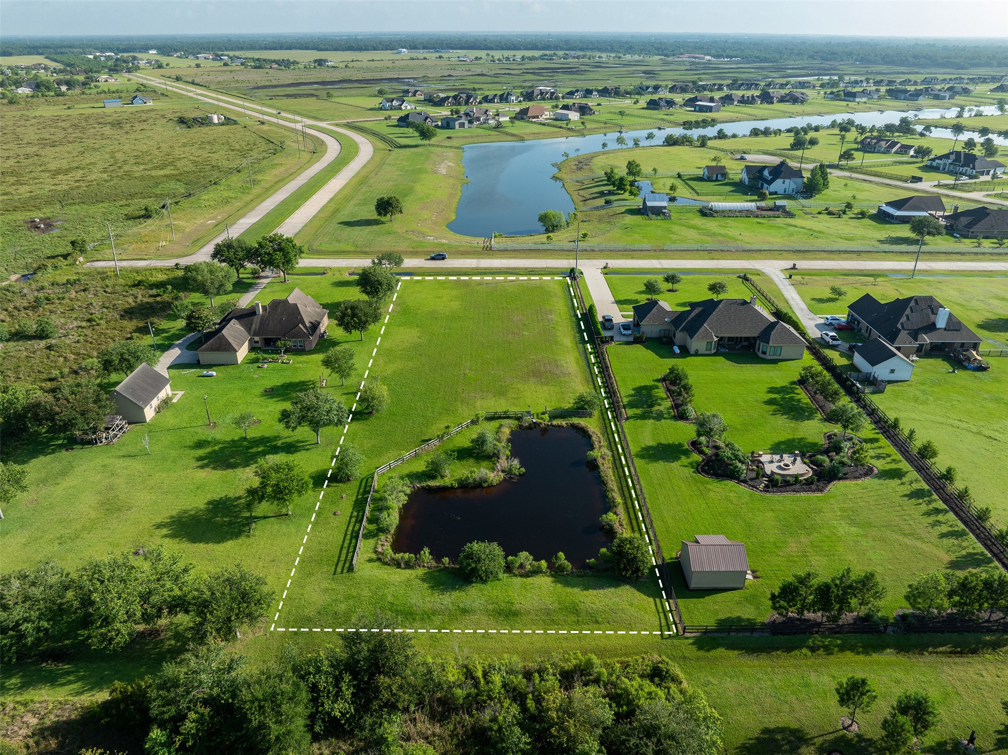 7706 Pebble Hill Lane Rosharon, TX 77583 - Photo 6 of 16 an aerial view of a golf course with a ocean view