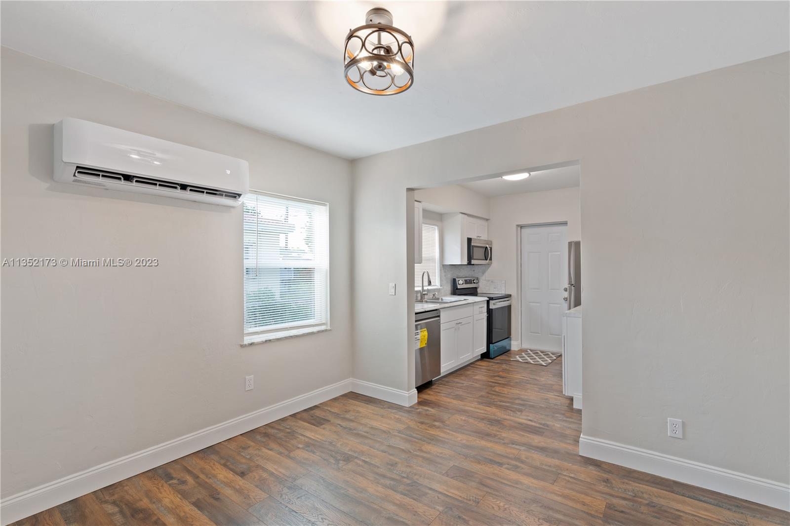 5571 Southwest 5th Terrace Miami, FL 33134 - Photo 12 of 37 a view of a room with wooden floor and a window
