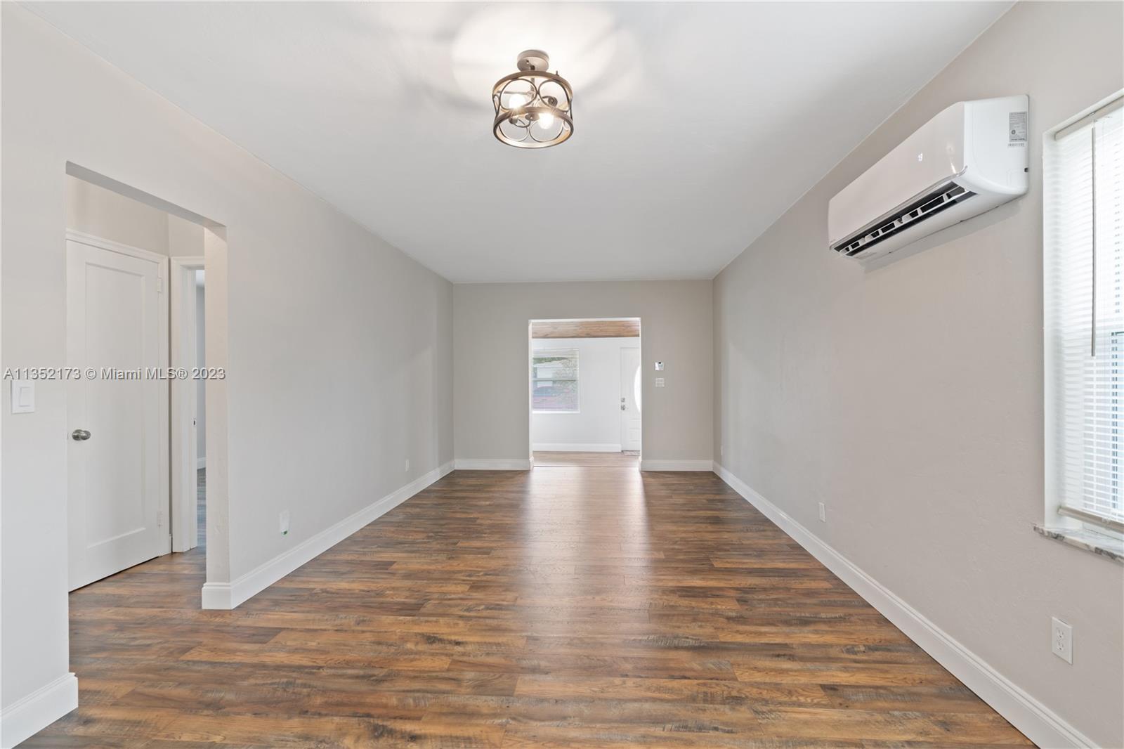 5571 Southwest 5th Terrace Miami, FL 33134 - Photo 15 of 37 a view of an empty room with wooden floor and a window