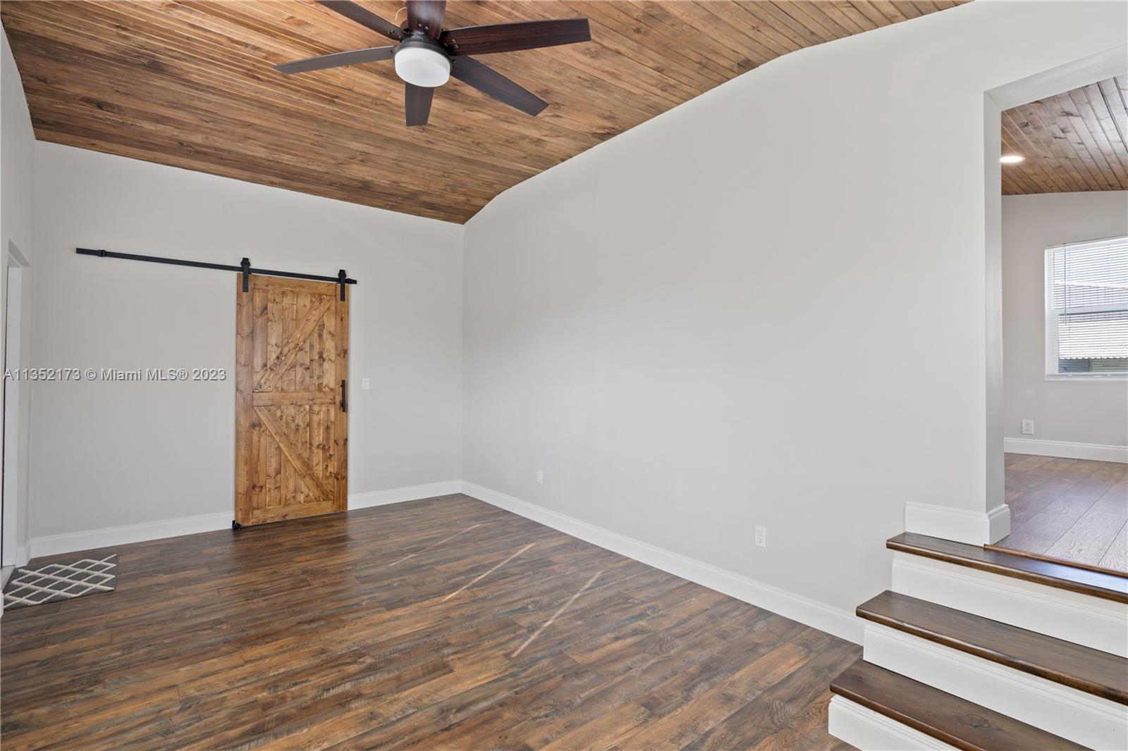 5571 Southwest 5th Terrace Miami, FL 33134 - Photo 19 of 37 a view of an empty room with wooden floor
