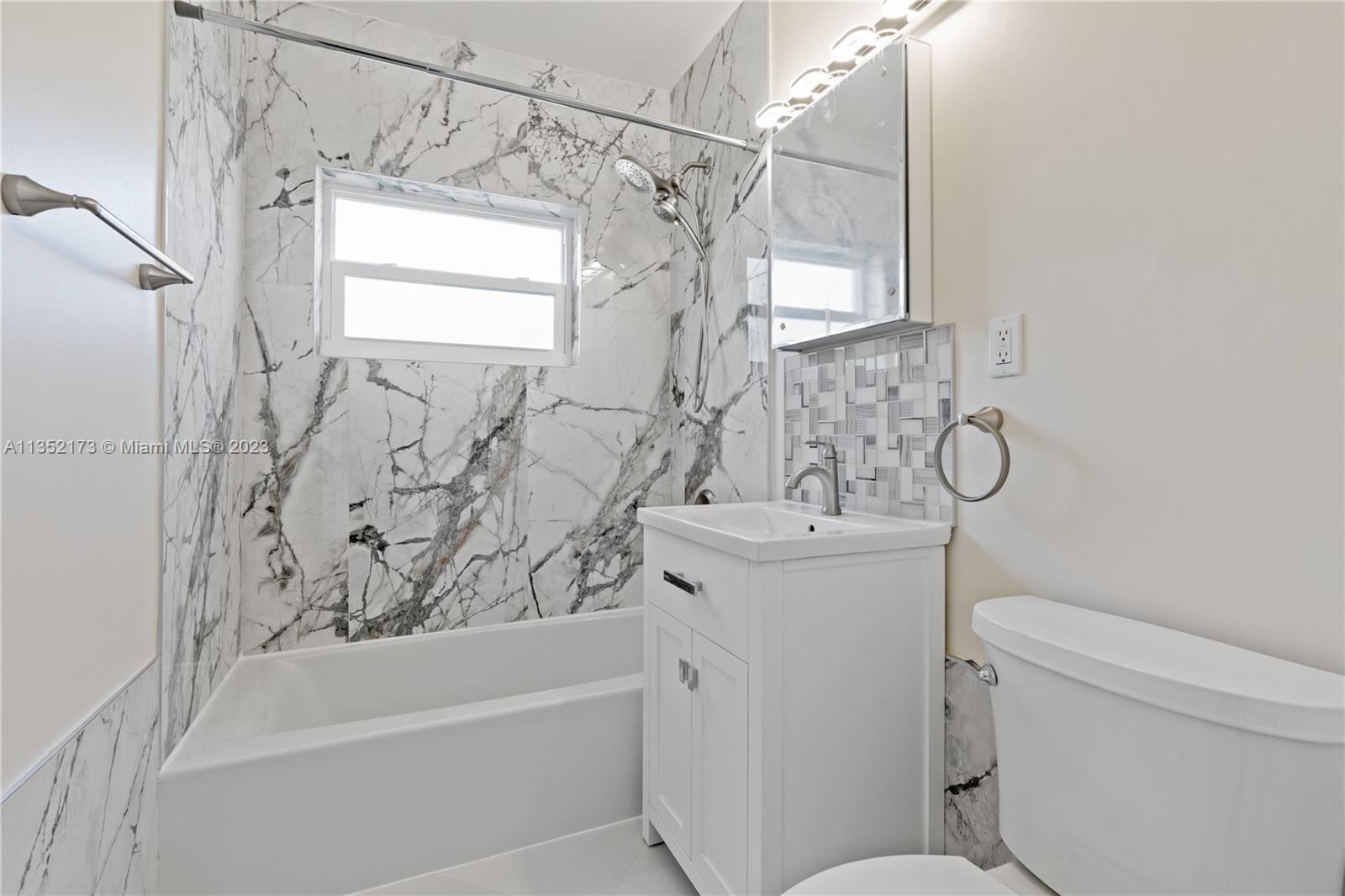 5571 Southwest 5th Terrace Miami, FL 33134 - Photo 22 of 37 a bathroom with a sink a toilet and a bathtub