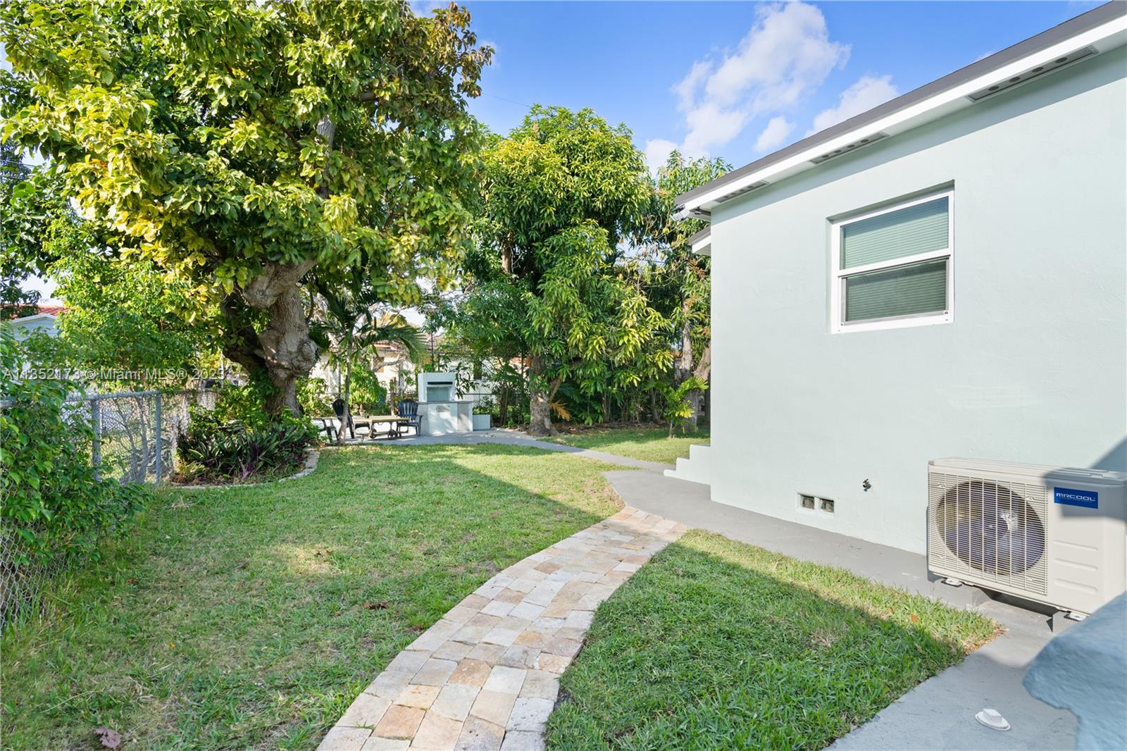 5571 Southwest 5th Terrace Miami, FL 33134 - Photo 24 of 37 a backyard of a house with table and chairs