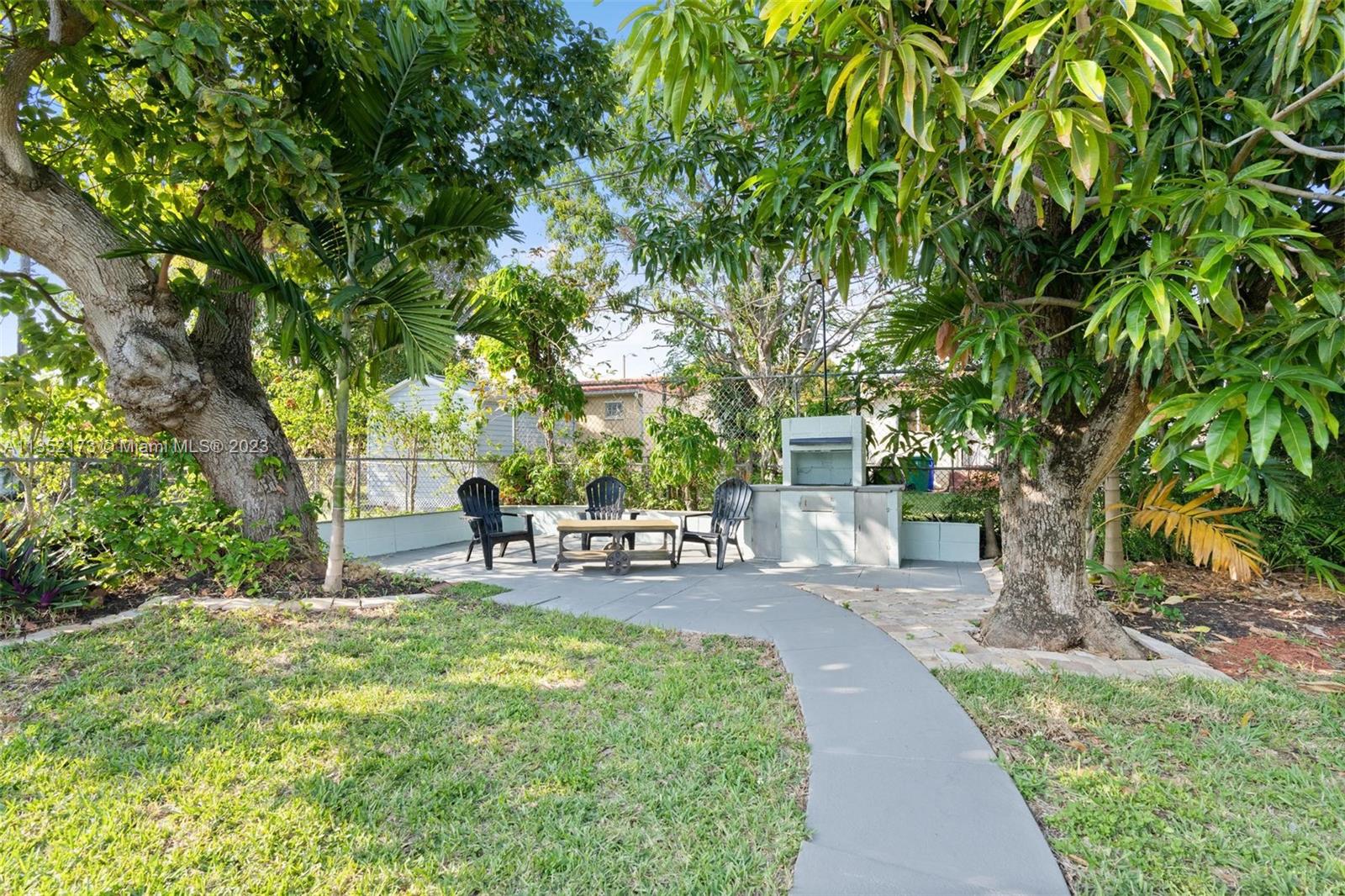 5571 Southwest 5th Terrace Miami, FL 33134 - Photo 25 of 37 a view of a chair and table in the garden