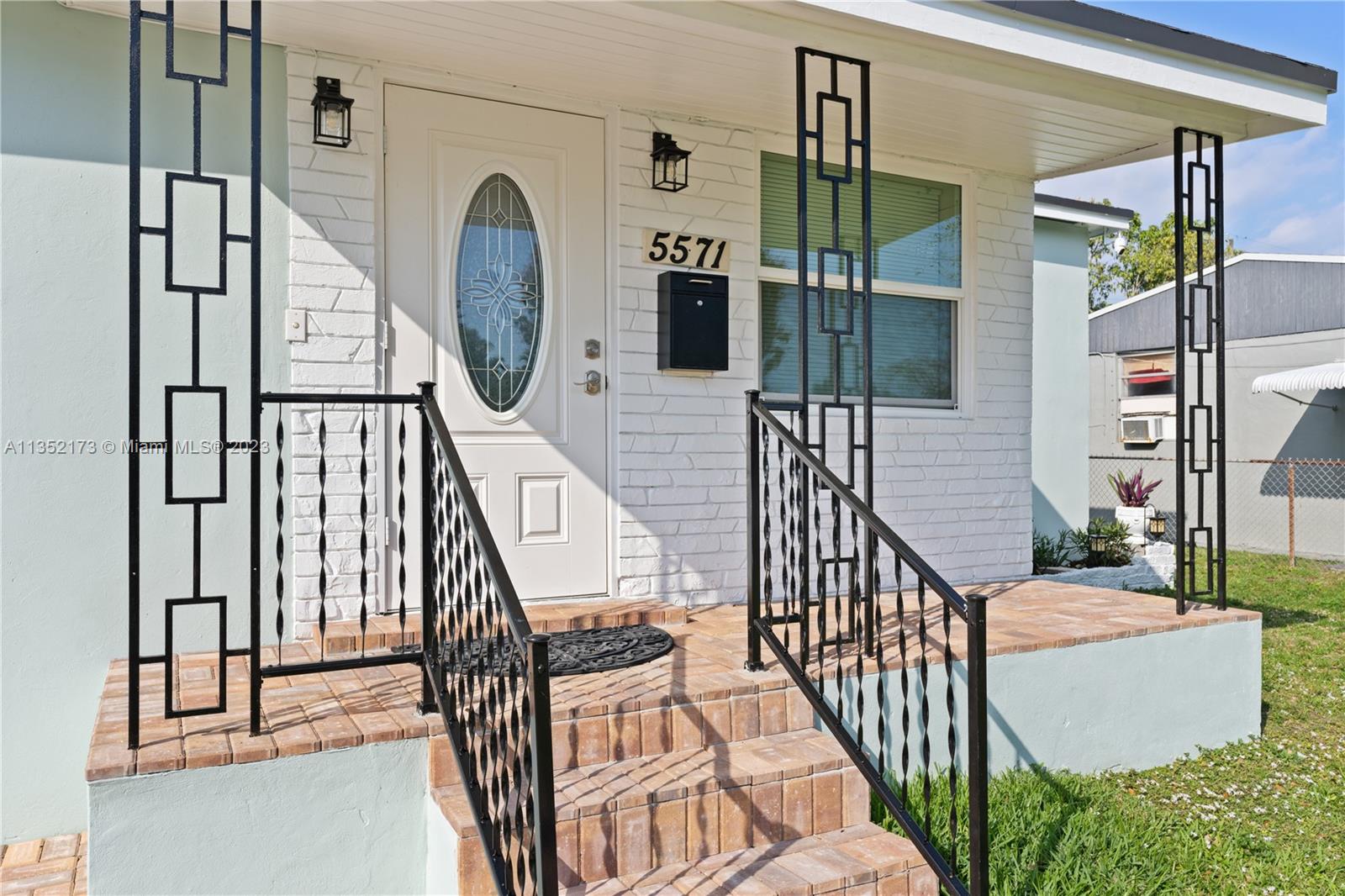 5571 Southwest 5th Terrace Miami, FL 33134 - Photo 3 of 37 a view of staircase with railing and a chandelier