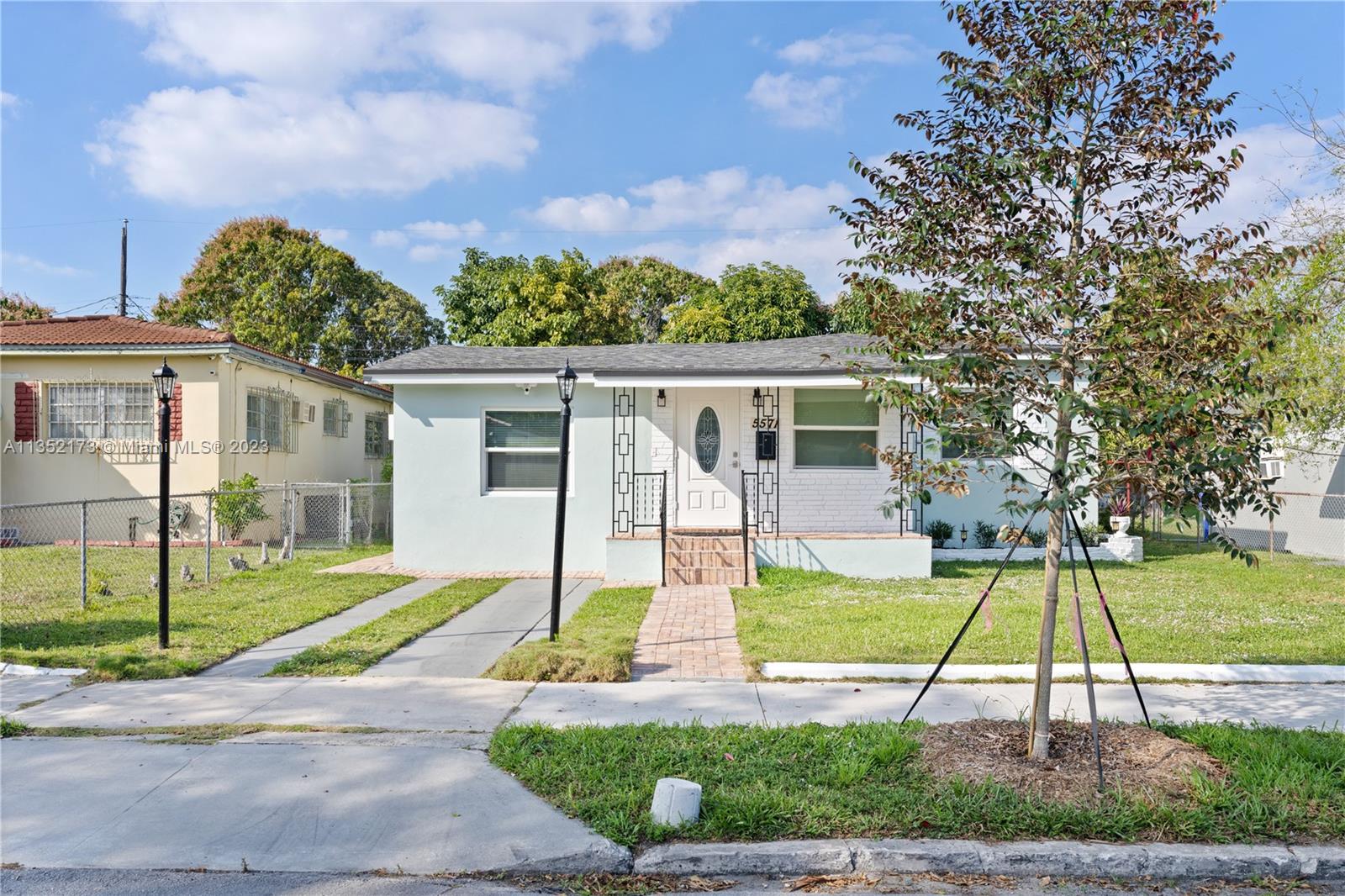 5571 Southwest 5th Terrace Miami, FL 33134 - Photo 31 of 37 a view of a house with a big yard and potted plants